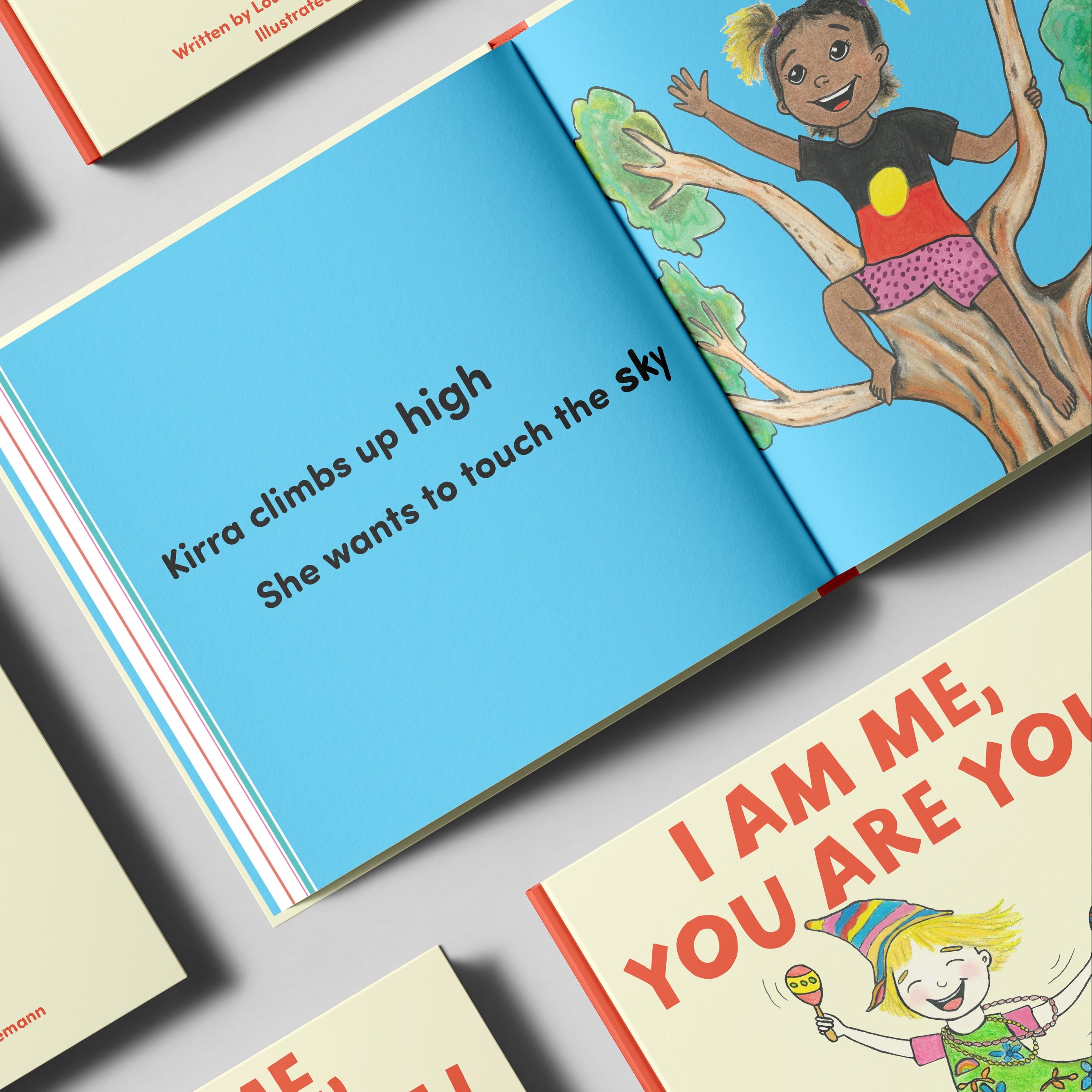 Children's book titled 'I Am Me, You Are You' with a focus on a page showing a child climbing a tree.